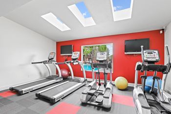 the gym at the enclave at woodbridge apartments in sugar land, tx